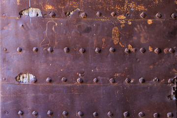Medieval surface of a metal gate. Background with selective focus and copy space