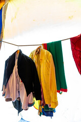 Variety of colored clothes hangers on back stage, theater or exhibition.