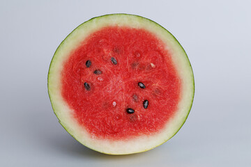 Juicy watermelon cut in half isolated on white background. Clipping path.