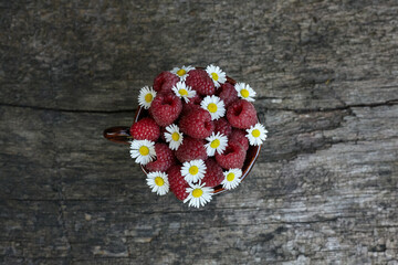 Raspberry and chamomile composition in a mug
