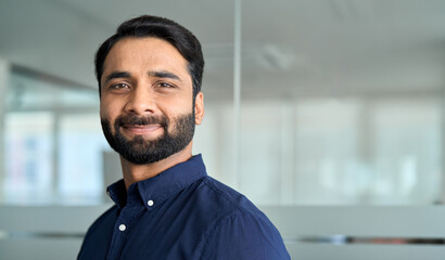Confident Indian business man lawyer, professional businessman manager in office, corporate executive, handsome leader, male employee from India looking at camera, headshot close up face portrait. - obrazy, fototapety, plakaty