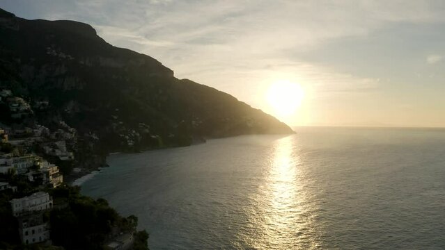 A sunrise over Positano, Italy.  Amalfi Coast.  4k aerial drone footage