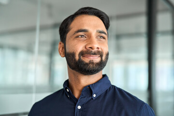 Confident smiling Indian business man, bearded professional businessman manager in office, corporate executive leader, male entrepreneur from India looking away, headshot close up face portrait. - obrazy, fototapety, plakaty