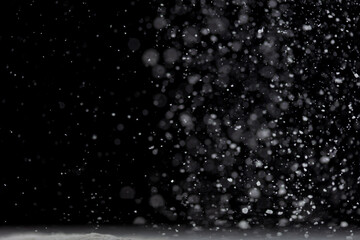 Tapioca starch flour fly explosion, White powder tapioca starch fall down in air. Seasoning flour powder is element material. Eyeshadow crush make up. Black background Isolated selective focus blur