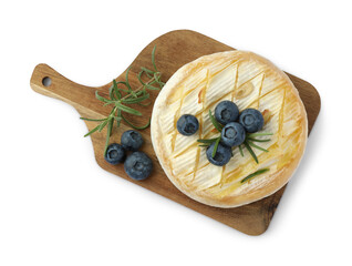Tasty baked brie cheese with rosemary and blueberries isolated on white, top view