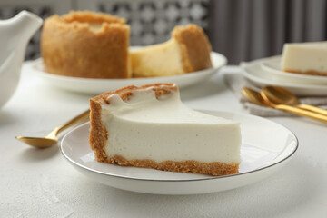 Piece of tasty vegan tofu cheesecake on white table, closeup