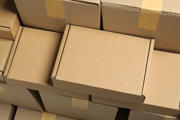 Many cardboard boxes as background, above view. Packaging goods