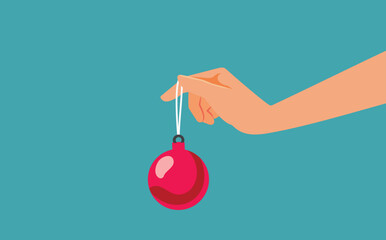 Hand Holding a Christmas Ball Vector Banner Design. Unrecognizable person offering a Christmas ornament as a gift 
