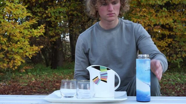 man drinking tea in autumn