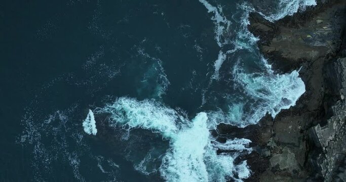 The mighty waves of the ocean crashing against the cliffs of Moher 4k