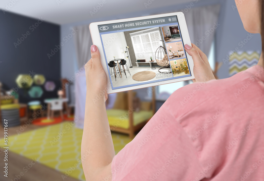 Poster woman using smart home security system on tablet computer indoors, closeup. device showing different