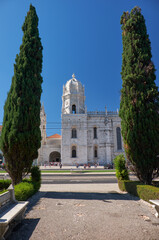 The view of Church of Santa Maria through the garden of Empire square. Lisbon, Portugal