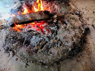 burning firewood in the fireplace
