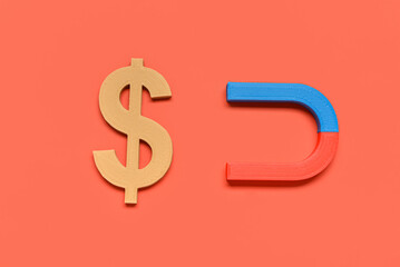 Horseshoe shaped magnet with dollar sign on red background. Attracting investments concept