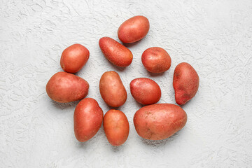 Fresh raw potatoes on white background