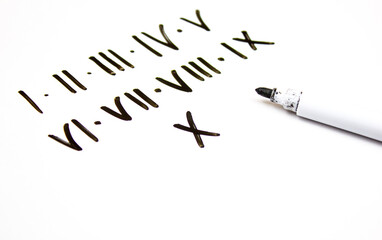 Roman numerals inscription with marker on a white board. Roman numerals from 1 to 10, I to X,...
