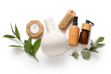 Composition with spa accessories and plant branches on white background