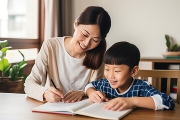 Mom helps son do homework sitting at table writing in notebook right answer. Boy asks mother to help with homework at table with laptop. Mom in cozy modern apartment helps her son with lessons