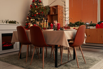 Festive dining table with Christmas setting in room