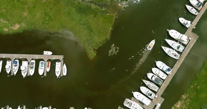 Sailboat yacht at stunning coastal marina in aerial panoramic view