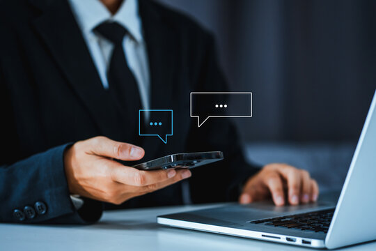 Chatbot chat AI concept, artificial intelligence Businessman using AI smart robot technology smartphone with Icon communication network social media network pop notification concept. - Powered by Adobe