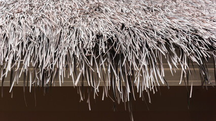 Dry sedge background used as a roof of natural dry grass background.