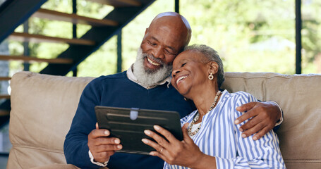 Tablet, hug and senior couple on a sofa for web communication, network or chat at home. Digital,...