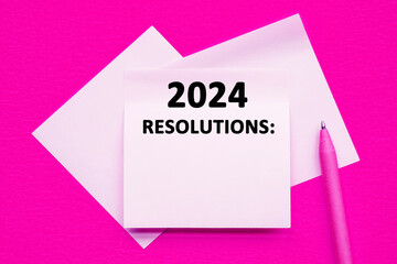 text 2024 RELUTIONS with colorful sticky notes on pink background.