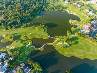 Aerial view of beautiful green golf field fairway and putting green, Top down image for sport background and travel nature background, Amazing  green nature view