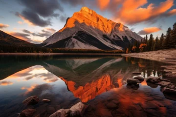 Photo sur Aluminium Canada Mountain lake at sunset, Banff National Park, Alberta, Canada, Sunrise reflection of a orange mountain at Lake Minnewanka in Banff National Park, Canada, AI Generated