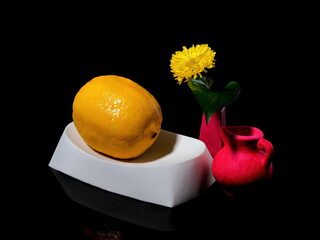 Composition with lemon bathing on a black background