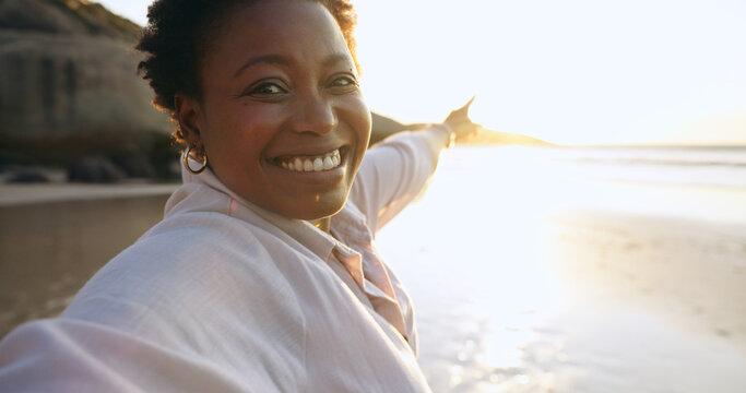 Woman, selfie and beach or portrait at sunrise, relaxing and peace for social media, post and update on holiday. Happy black person, pointing and ocean on vacation, getaway and travel, fun or nature