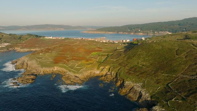 Aerial View Of Rock Fence On The Mountain Hills Overlooking The Laxe Town And Beach In Spain.