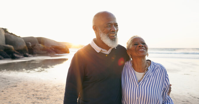 Senior couple, smile and hug by ocean, love and bonding on vacation, holiday and trip to beach. Happy black people, embrace and support or trust, commitment and connection in marriage or retirement