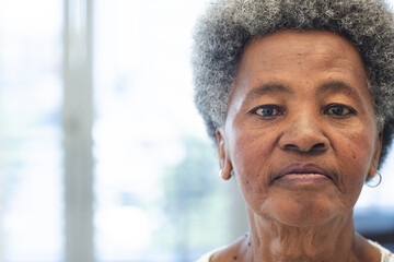 Portrait of african american woman in hospital waiting room with copy space