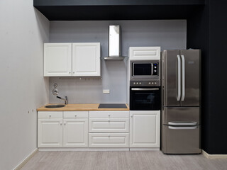 Interior Of Modern White Clean Kitchen With Microwave Oven
