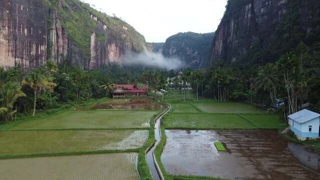 Harau, West Sumatra, Indonesia - View of the village and forest between two rocky hills in the Harau Valley. photographed using a drone.