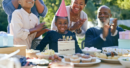 Family, birthday and applause at party with cake, celebration and excited or smile together in...