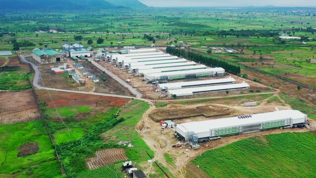 Premium poultry farm in rural Kuje, Nigeria - pullback aerial view