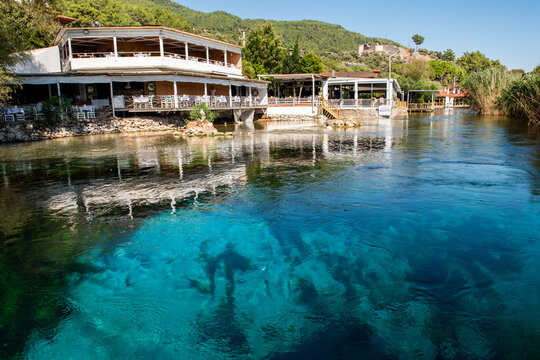 Mugla, Turkey - September 11, 2023: Azmak River in Akyaka District in Ula, Mugla, Turkey. Beautiful view of Azmak River. Natural aquarium.