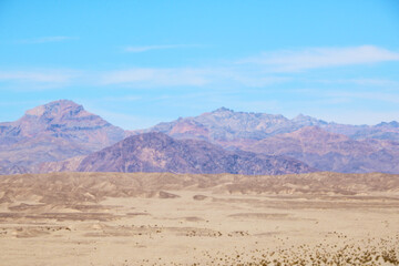 Out of focus. Blurred background of the silhouette of mountains on a hot day.