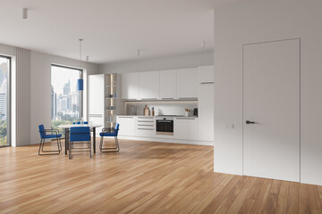 Obraz premium White home kitchen interior with dinner table and seats, cabinet with window