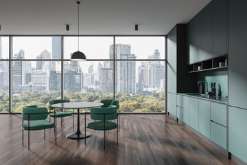 Panoramic gray and green kitchen interior with dining table