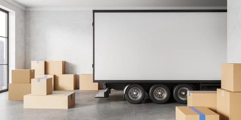 Foto op Plexiglas Empty trucking van in living room, relocation and cardboard boxes © ImageFlow