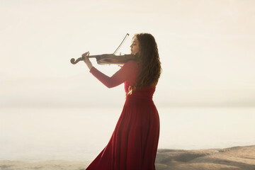 surreal portrait of woman dressed in red passionately playing the violin, abstract concept