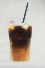 Americano coffee with orange juice in glass. Close up