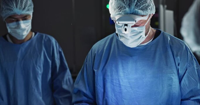 Surgery, team of doctors and scissors in operation theater, hospital and clinic. Group, medical nurse and surgeon tools in emergency room for healthcare, treatment and people working to help in ICU