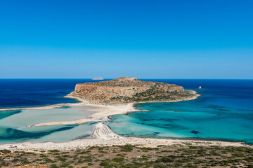 Blue lagoon in Balos, Crete, Greece. Beautiful lagoon at Mediterranean Sea. Balos Bay capture on the top of the mountain. View from above on a Gramvousa Island. - obrazy, fototapety, plakaty