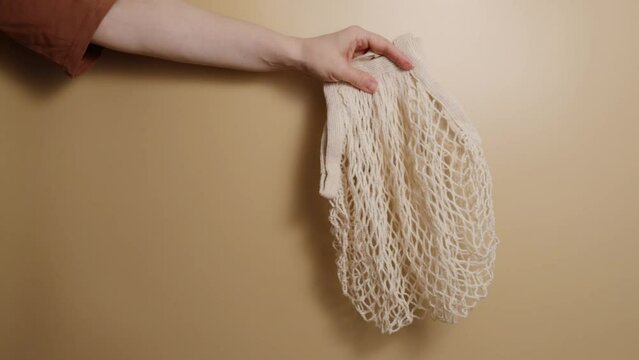 Reusable mesh bag in hand,string bag for market shopping,zero waste