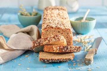 Healthy bran bread with seeds and ears of grains..